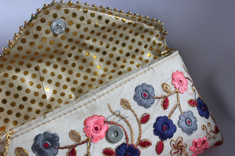 Thread embroidered clutch